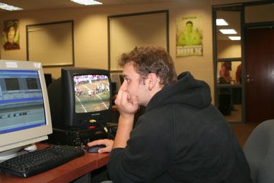 Video student working on a football highlights video
